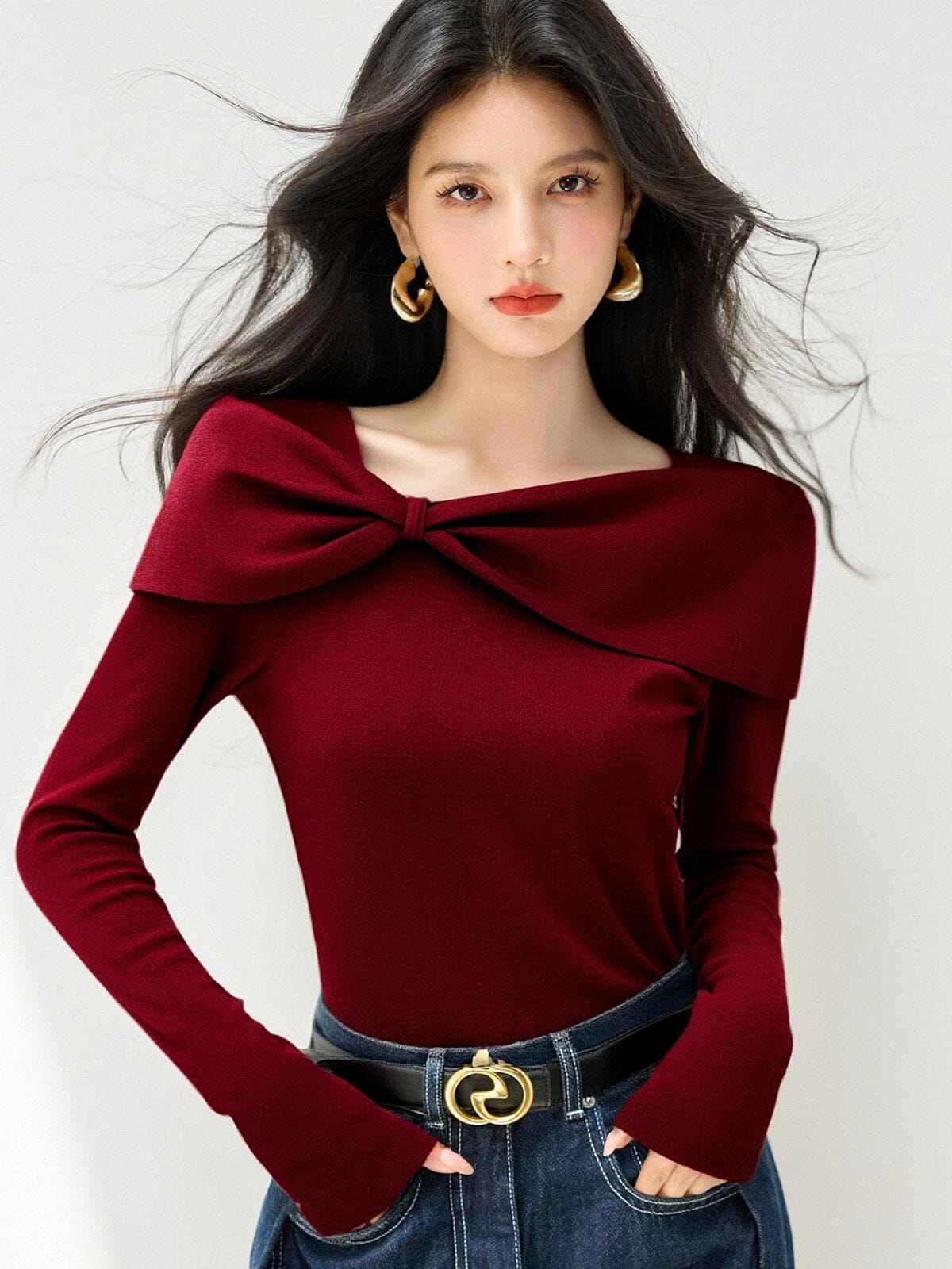 Aria cream knit sweater showing the off-shoulder neckline and fitted body