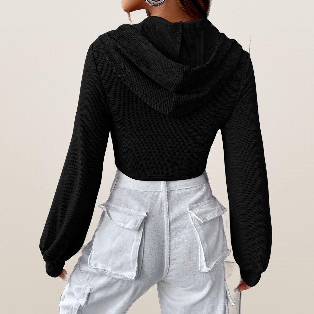 Lucie cropped hooded top in black, back view with hood