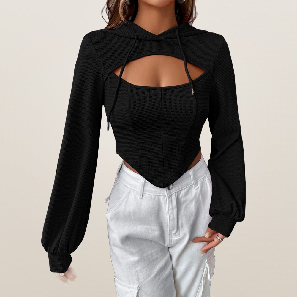 Lucie cut-out top in black worn with white cargo trousers