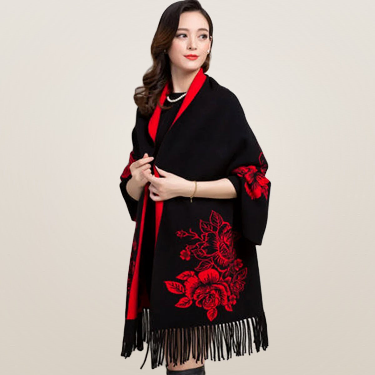 Isabeau poncho in black with red floral print